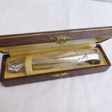 Silver metal sugar clamp in its case