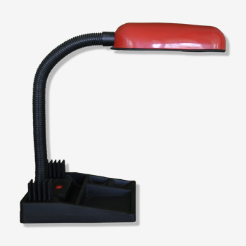 Red and black desk lamp with vacuum pocket and briefcase