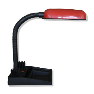 Red and black desk lamp with vacuum pocket and briefcase