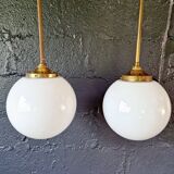 Pair of Art Deco pendant lights in brass and white opaline, 1920-30