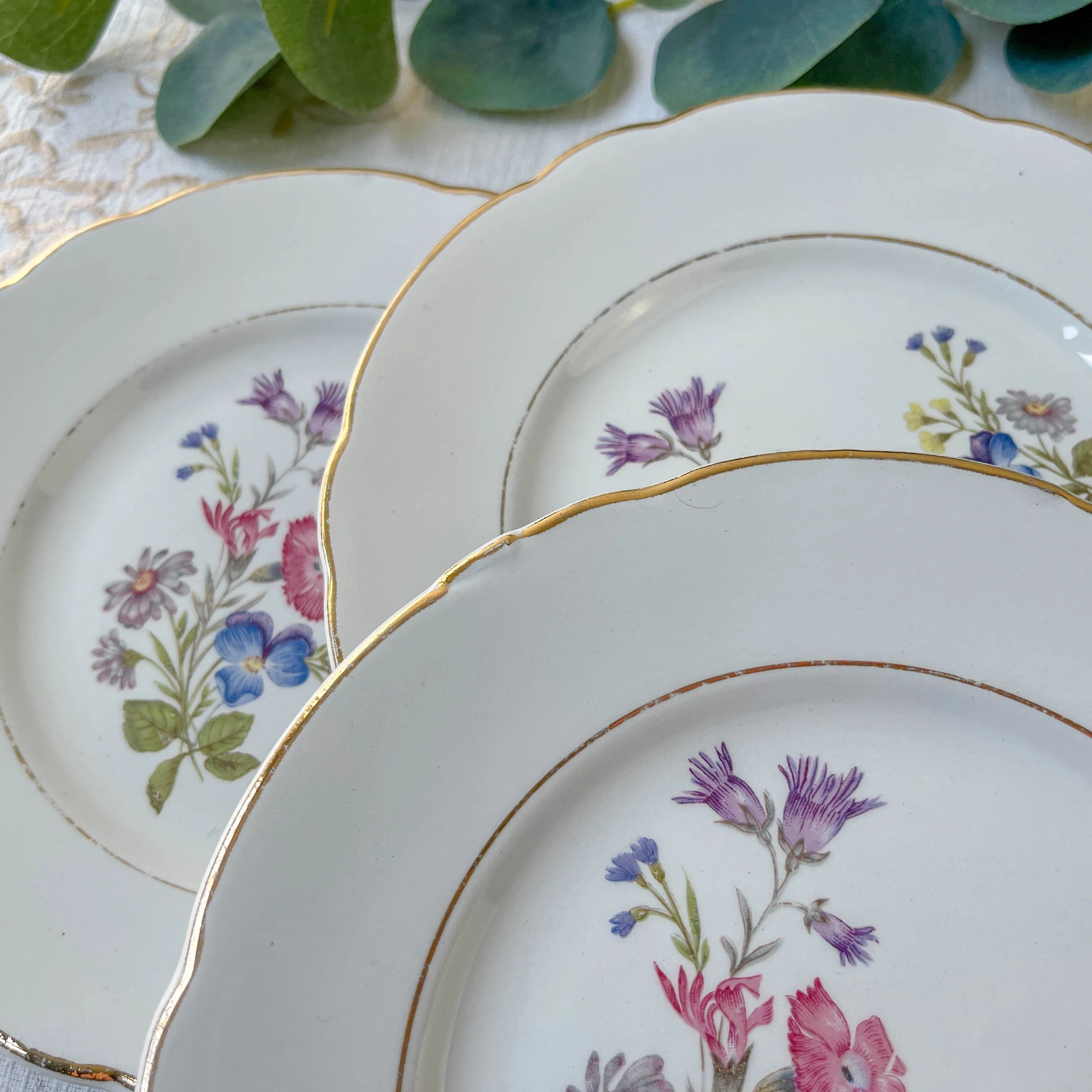 7 small vintage porcelain plates with floral pattern KG Luneville