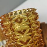 A set of wall lamps in teak wood, with amber colored glass