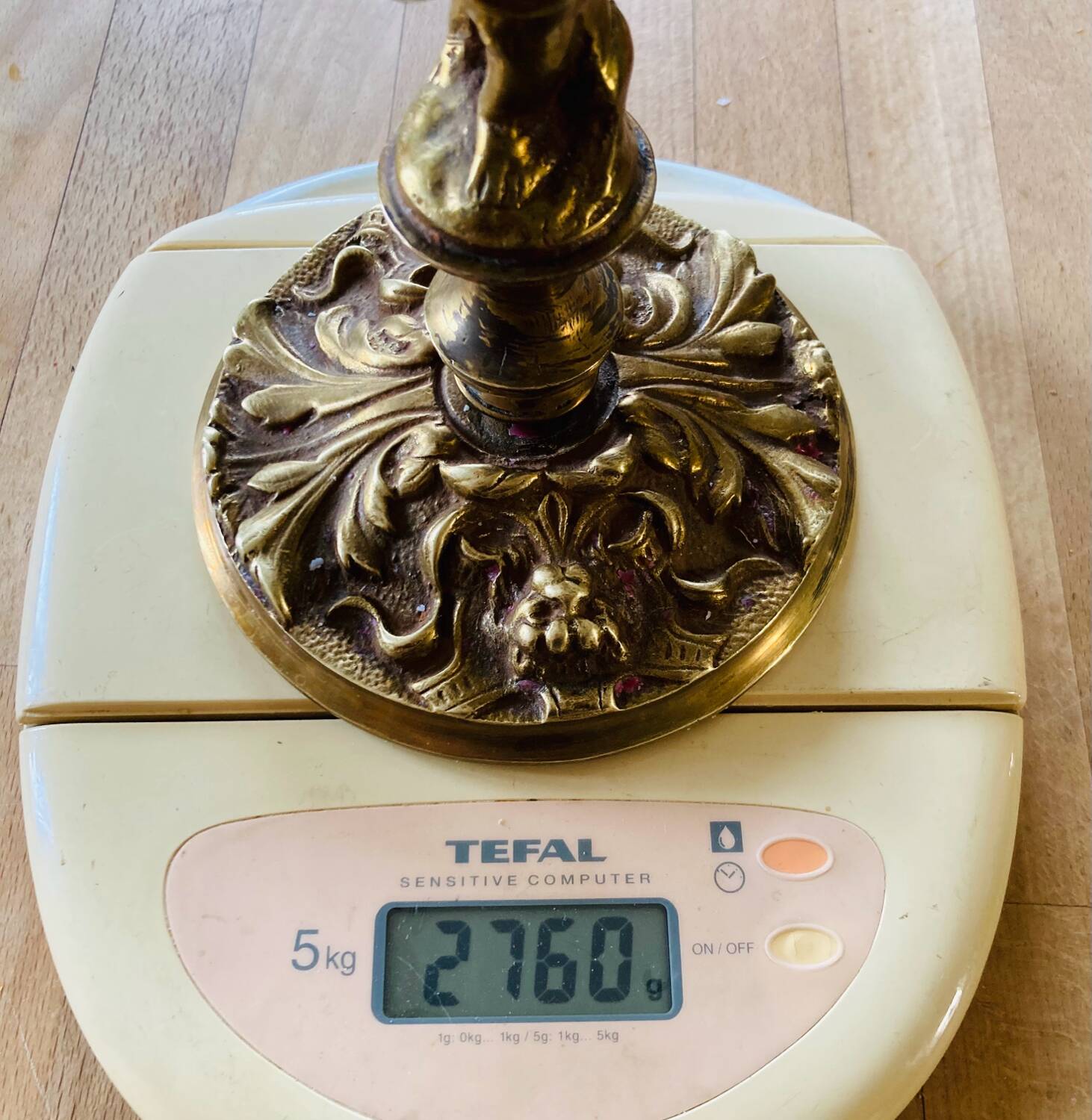 Solid bronze candlesticks decorated with putti, acanthus leaves and lion heads