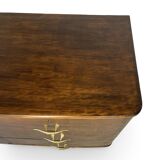 A vintage Italian chest of drawers, made of veneered walnut and solid wood,