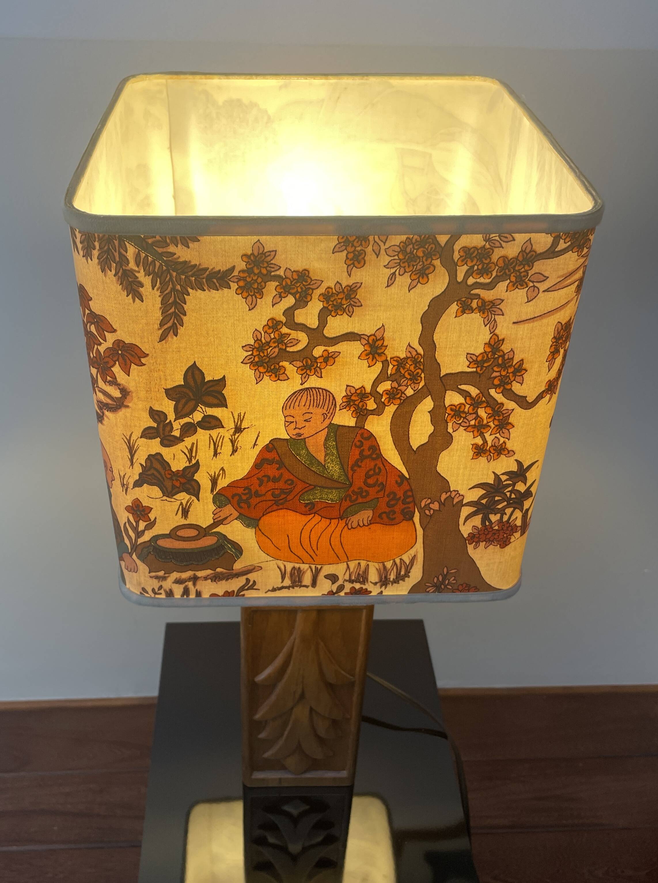 Wooden lamp with carved plant decoration from 1930-50, sold with a 1970 lampshade.