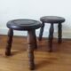 2 round tripod stools