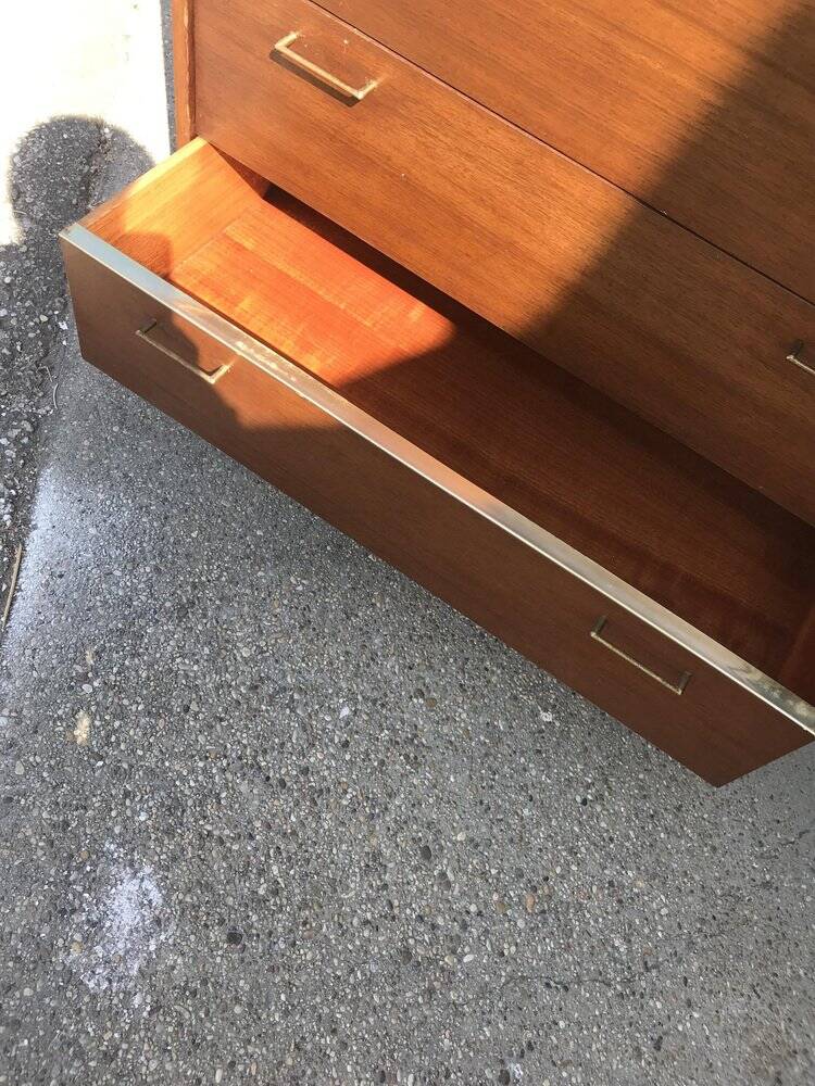 Mid-century teak chest of drawers in brown with four drawers, brass handles, 1960s.