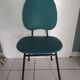 Vintage chair in turquoise green vinyl with black metal legs