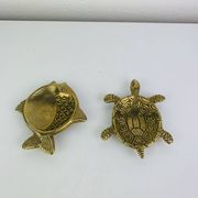 Pair of animal trinket trays in brass, fish and turtle.