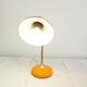 Orange colored metal desk lamp from the 1960s-1970s