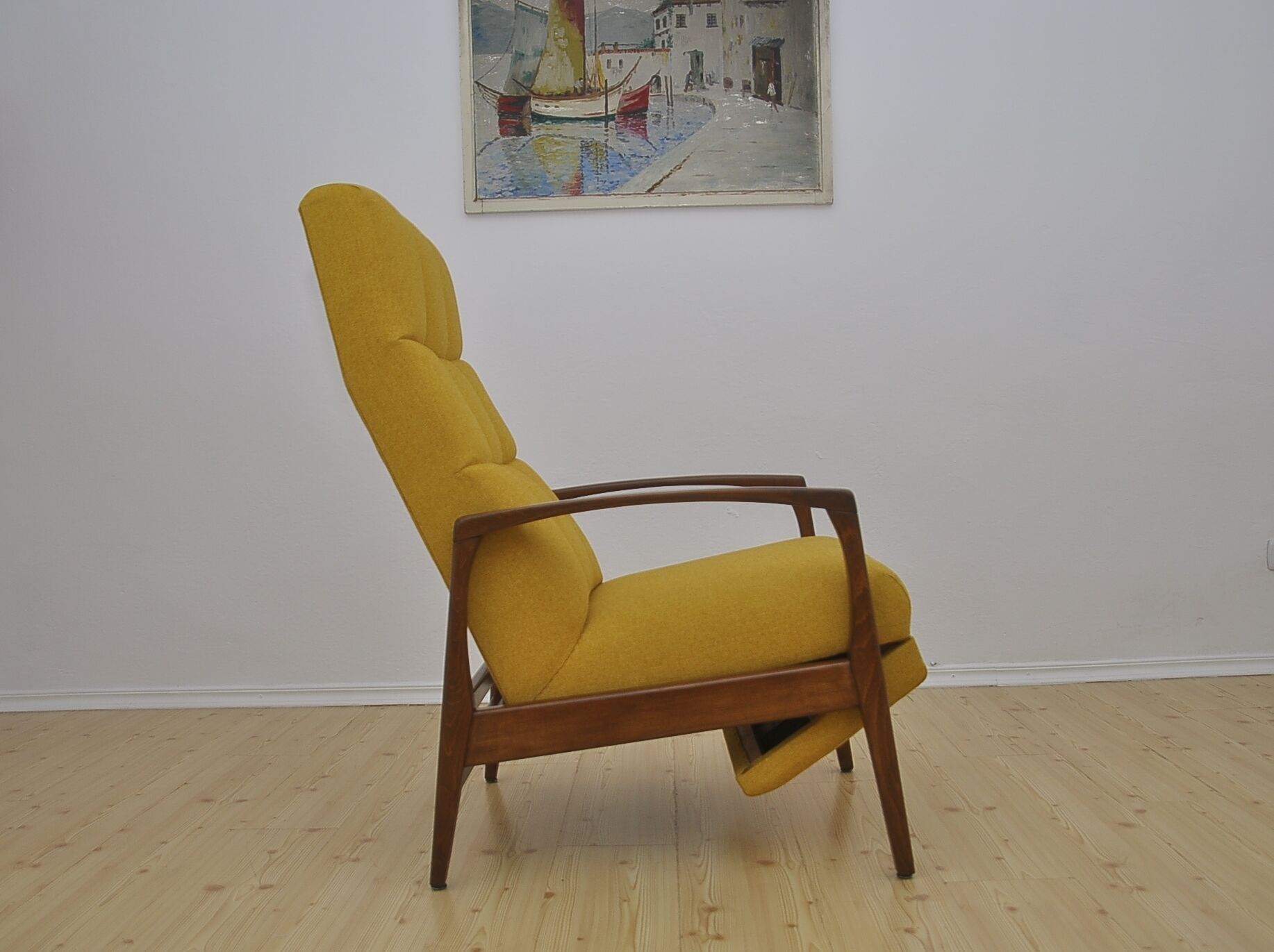 Mid-century armchair with folding footrest, 1960s