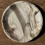 Tray, circular dish or plate made of white striped grey petrified wood.
