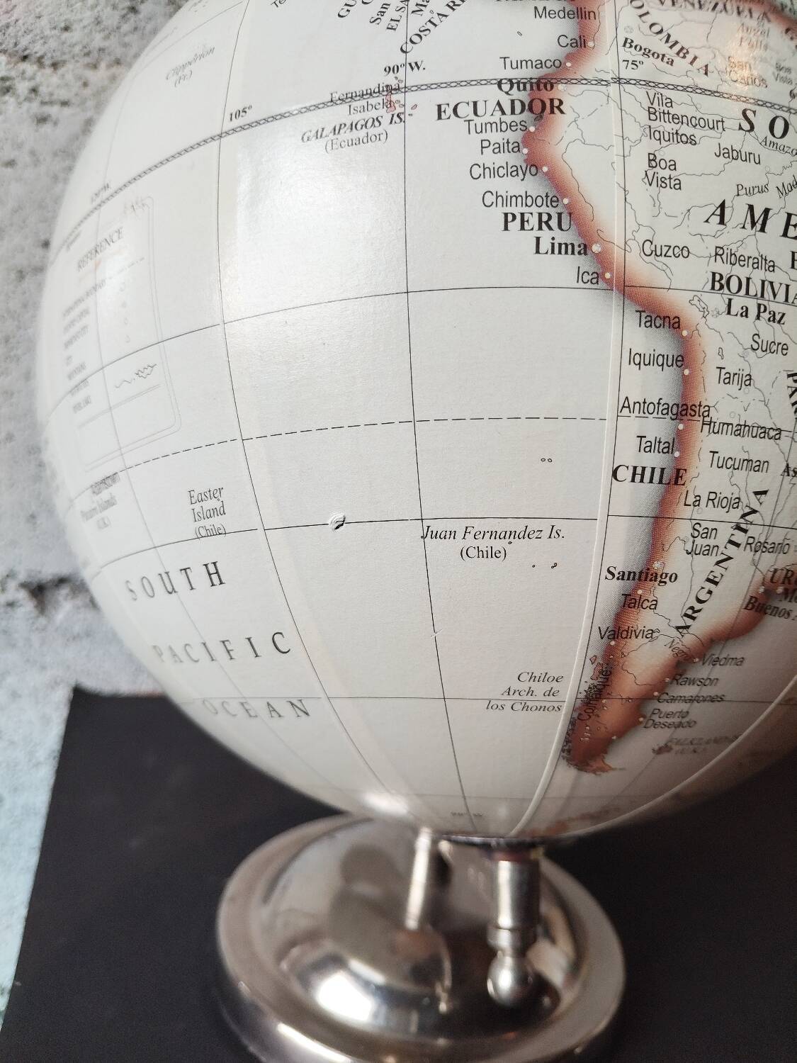 Decorative terrestrial globe on silver metal stand – explorer style