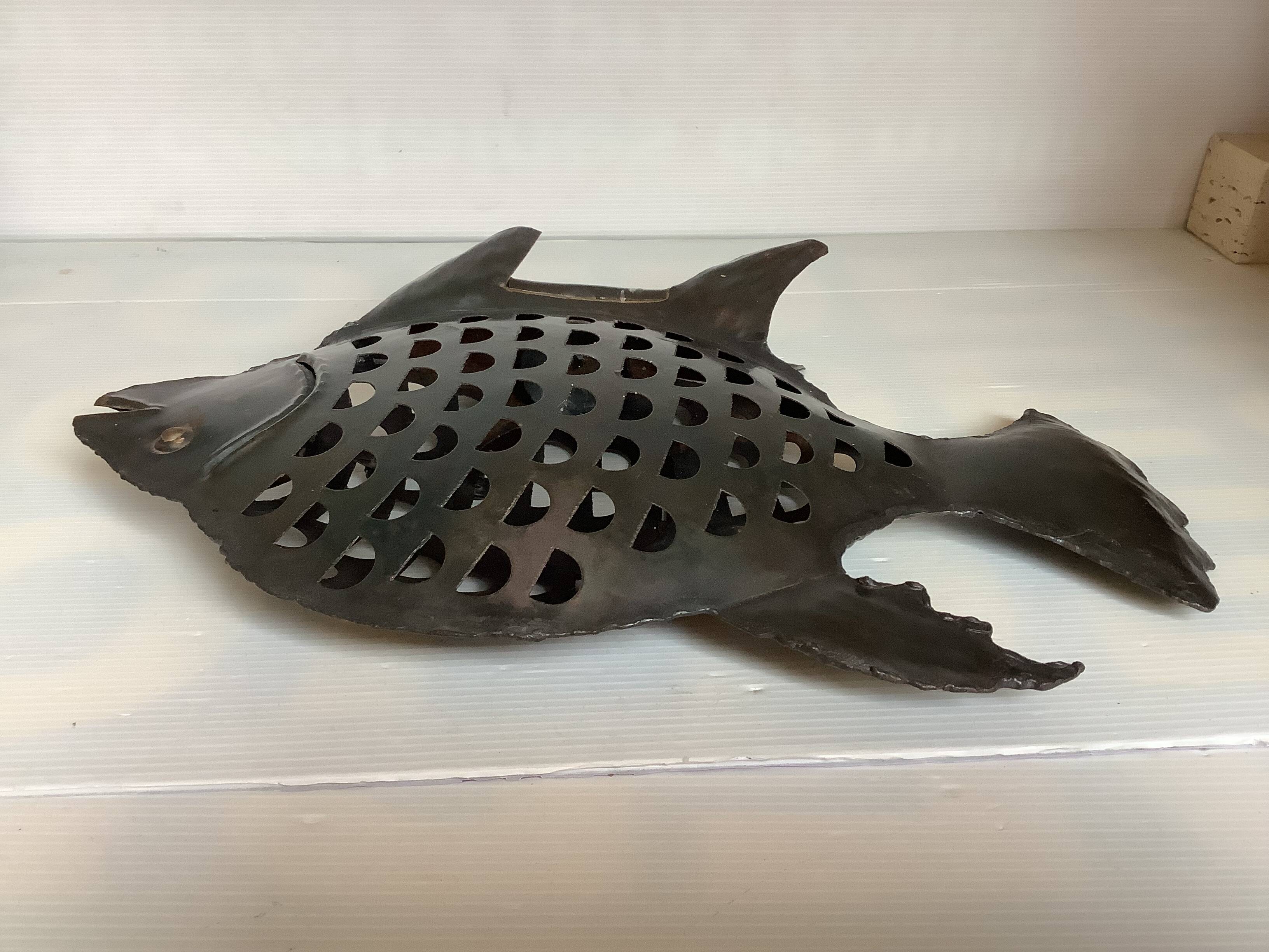 Large metal fish-shaped candle holder
