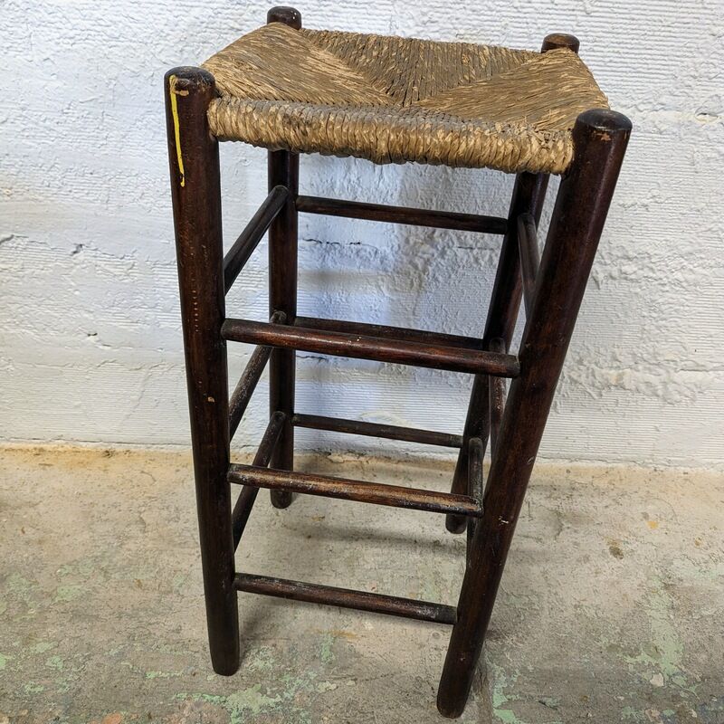 High wooden stool and straw