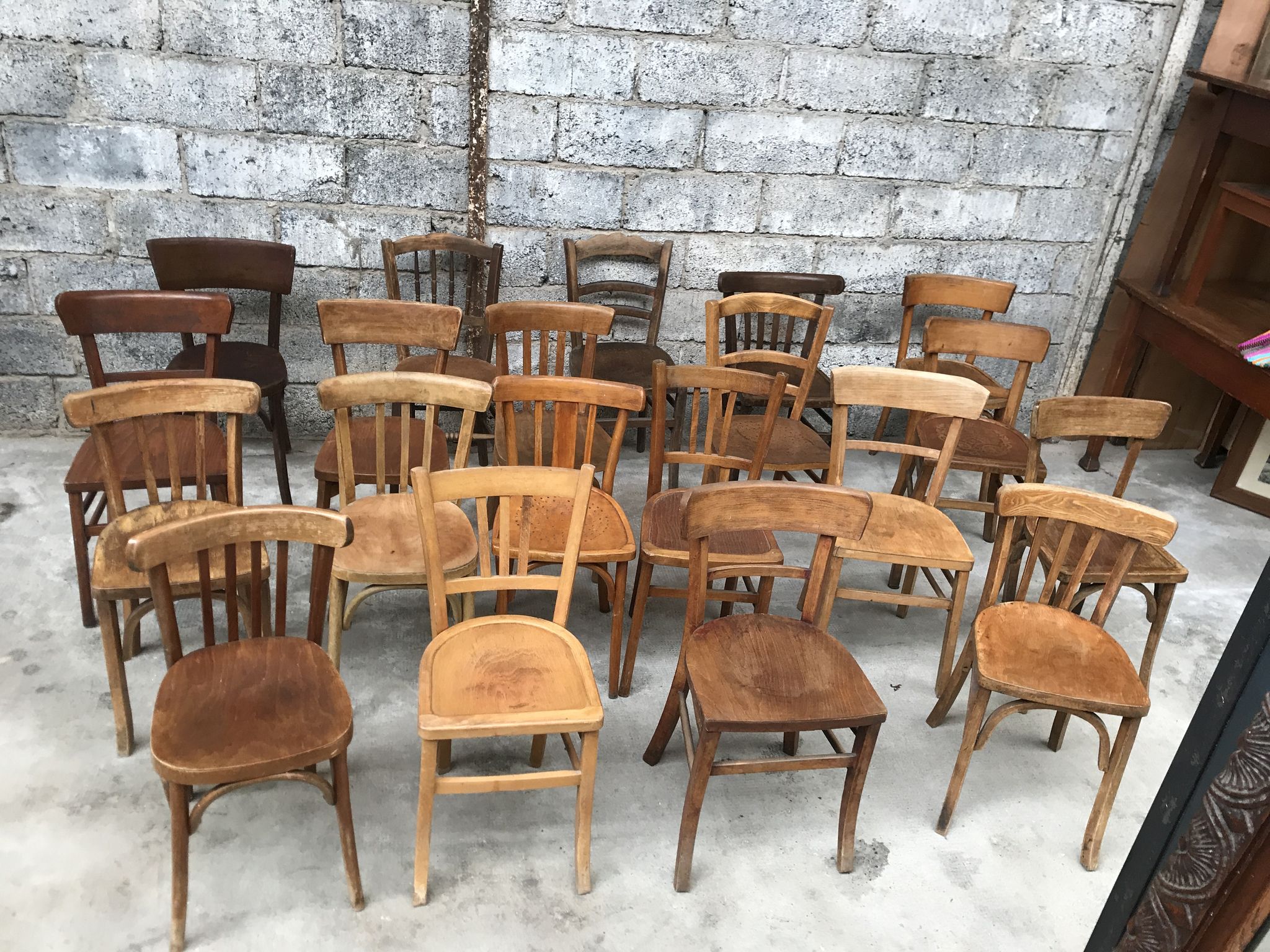 Set of 15 mismatched curved wood bistro chairs
