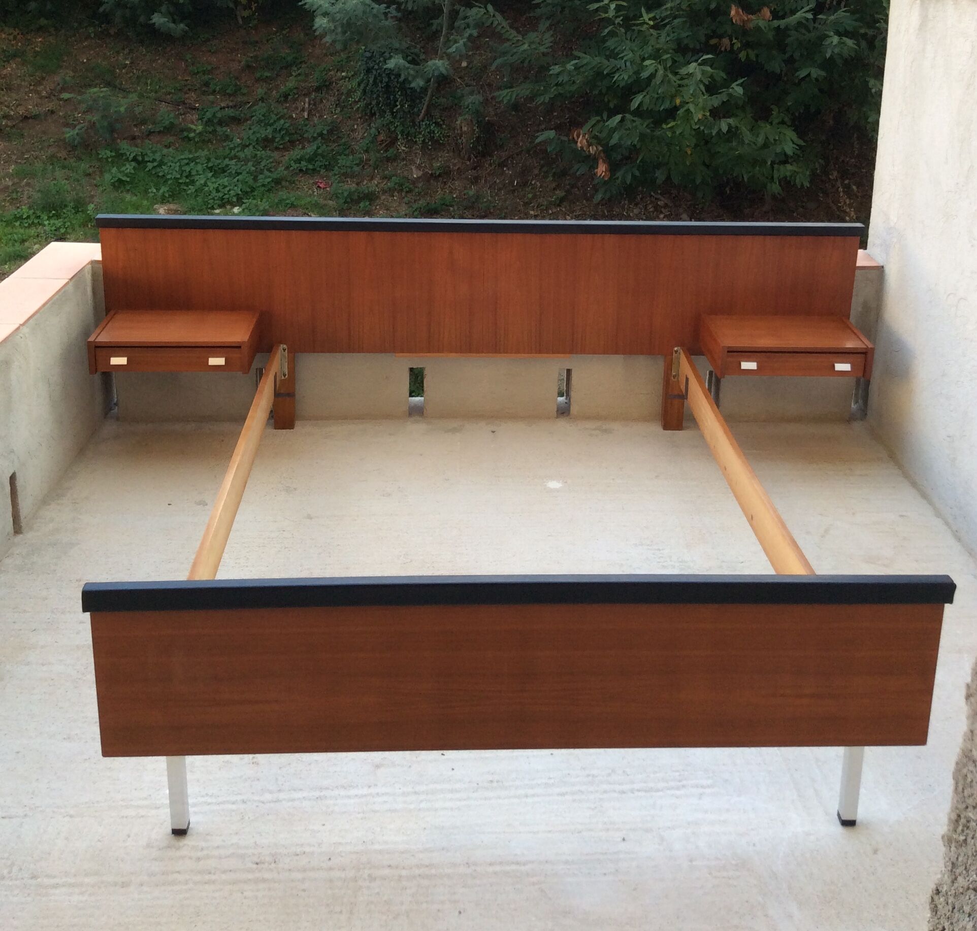 Scandinavian-style teak bed with integrated nightstands