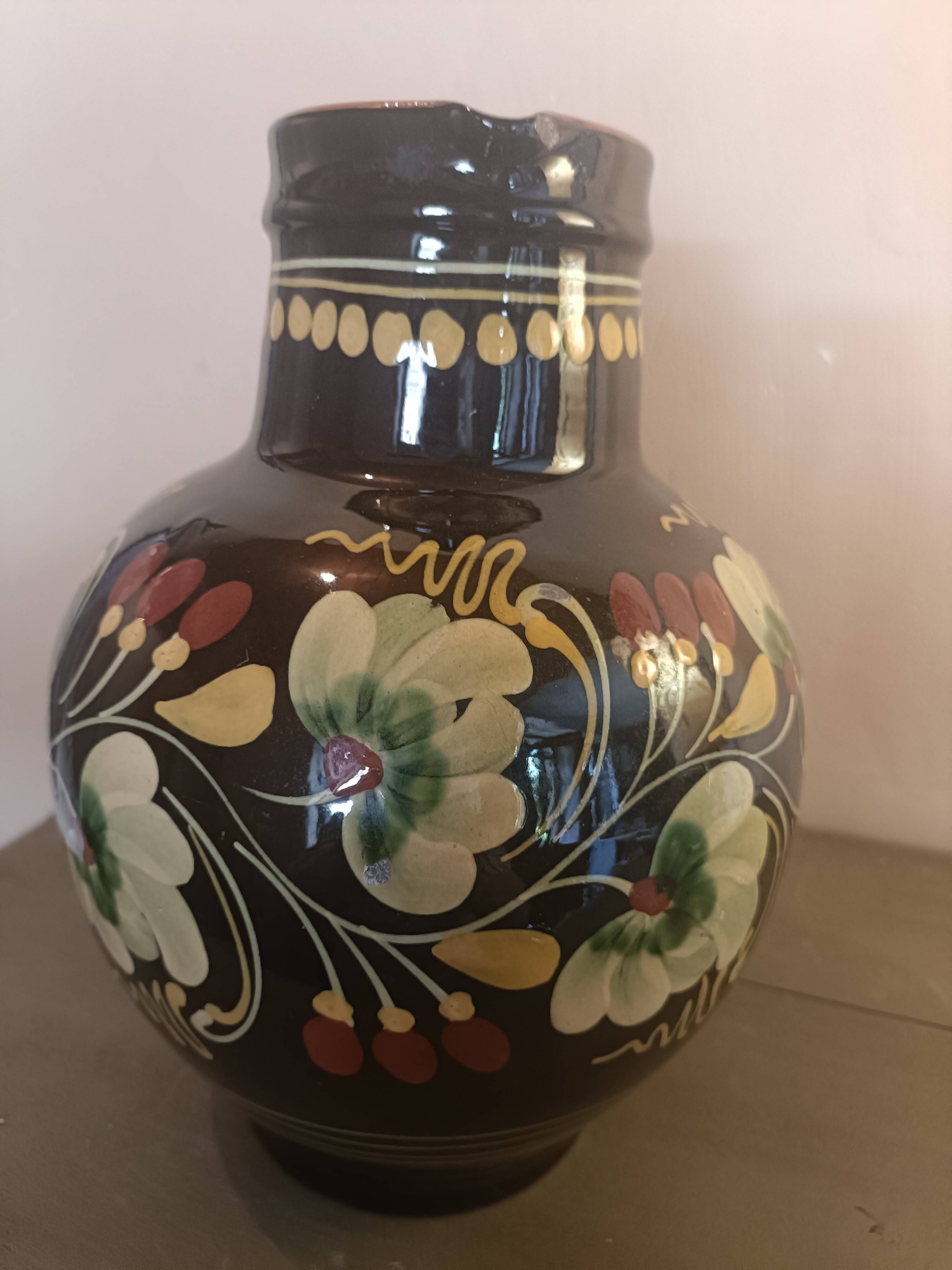 Large glazed terracotta pitcher with floral decoration