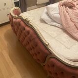 Upholstered bed in rosewood fabric