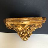 Wall console in gilded plaster