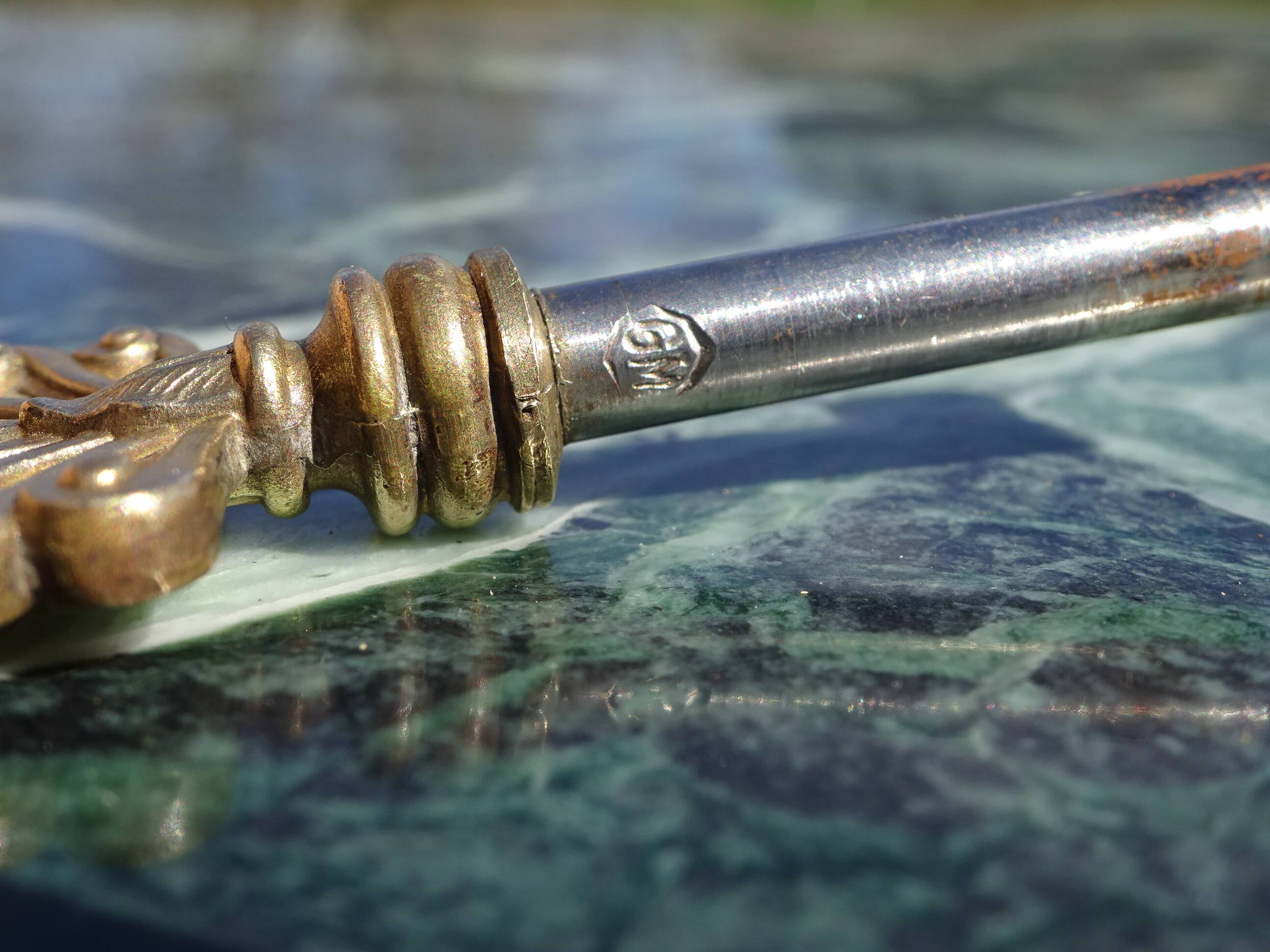 Flamed mahogany enfilade with sea green marble in Empire style.
