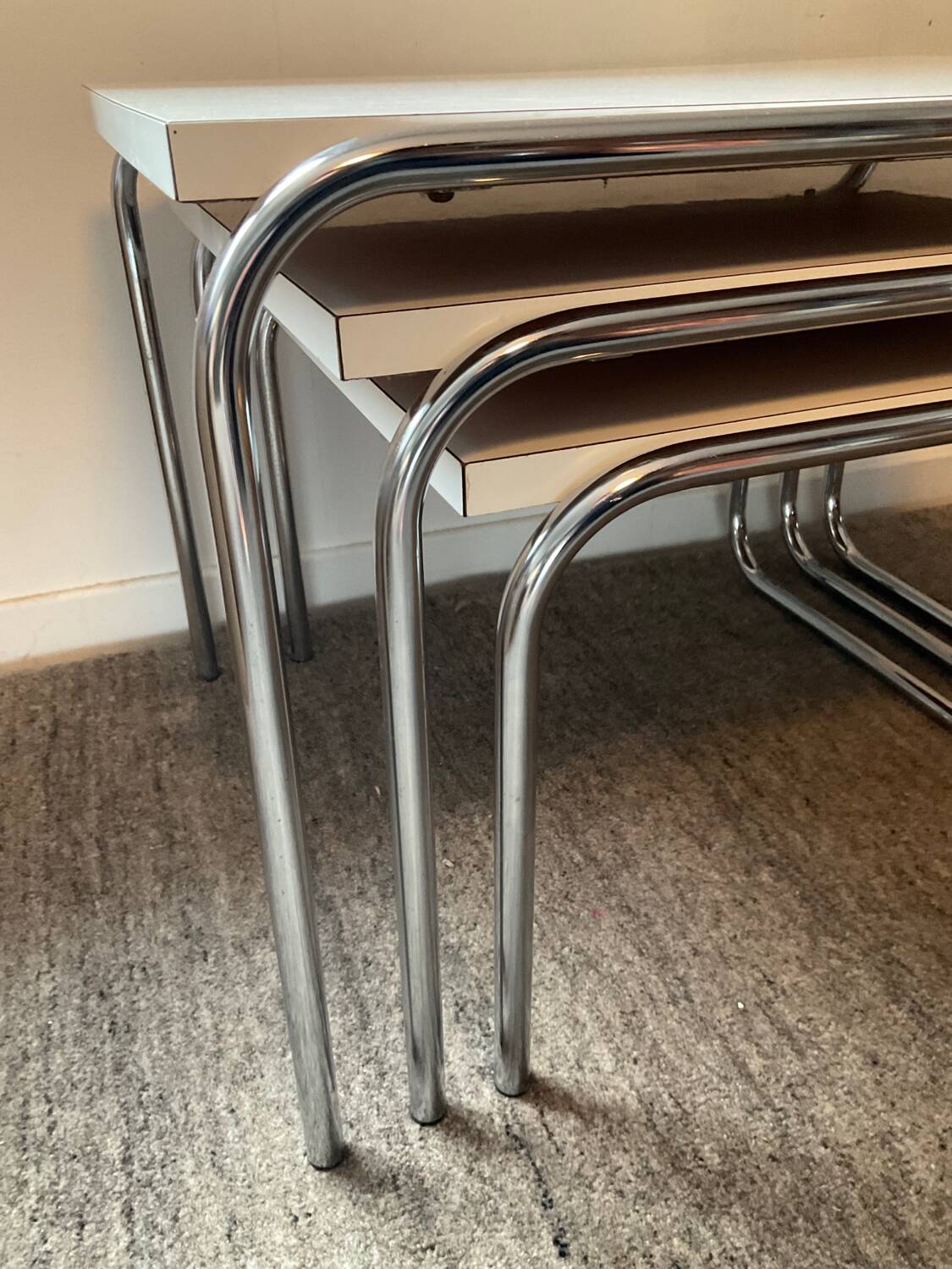 Trio of vintage nesting tables in Formica and chrome metal