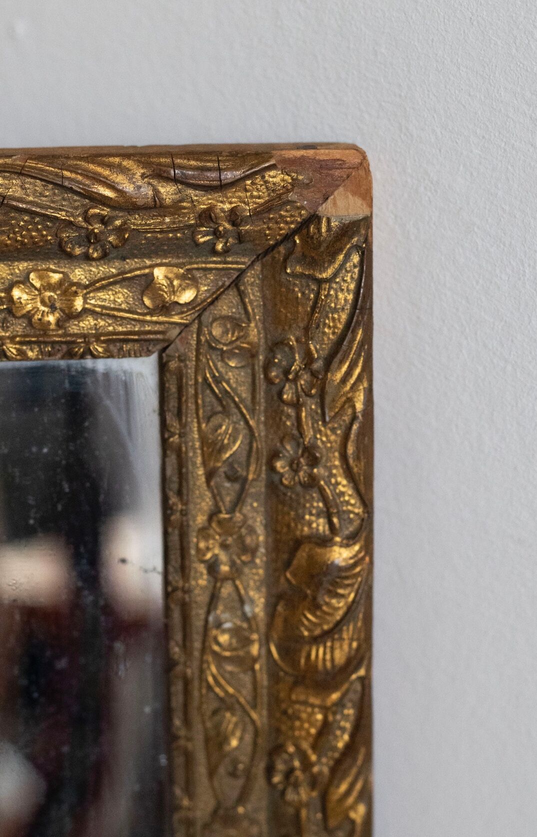 Antique mirror in gilded wood