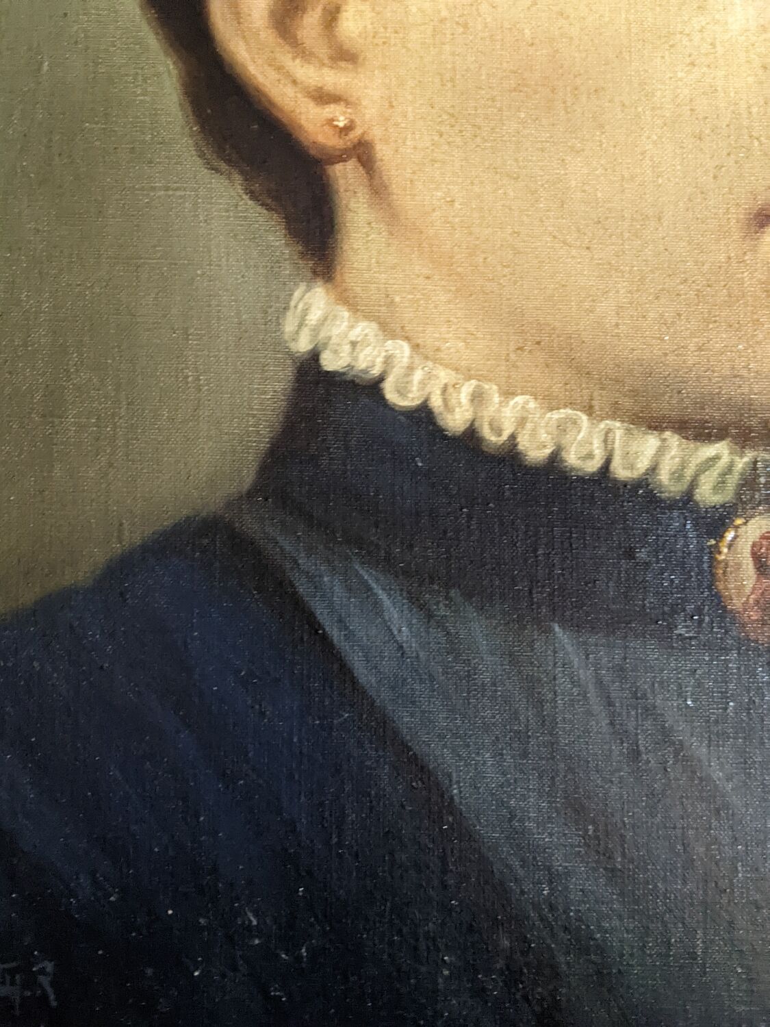 Oil on canvas portrait in an antique gilded wooden frame.