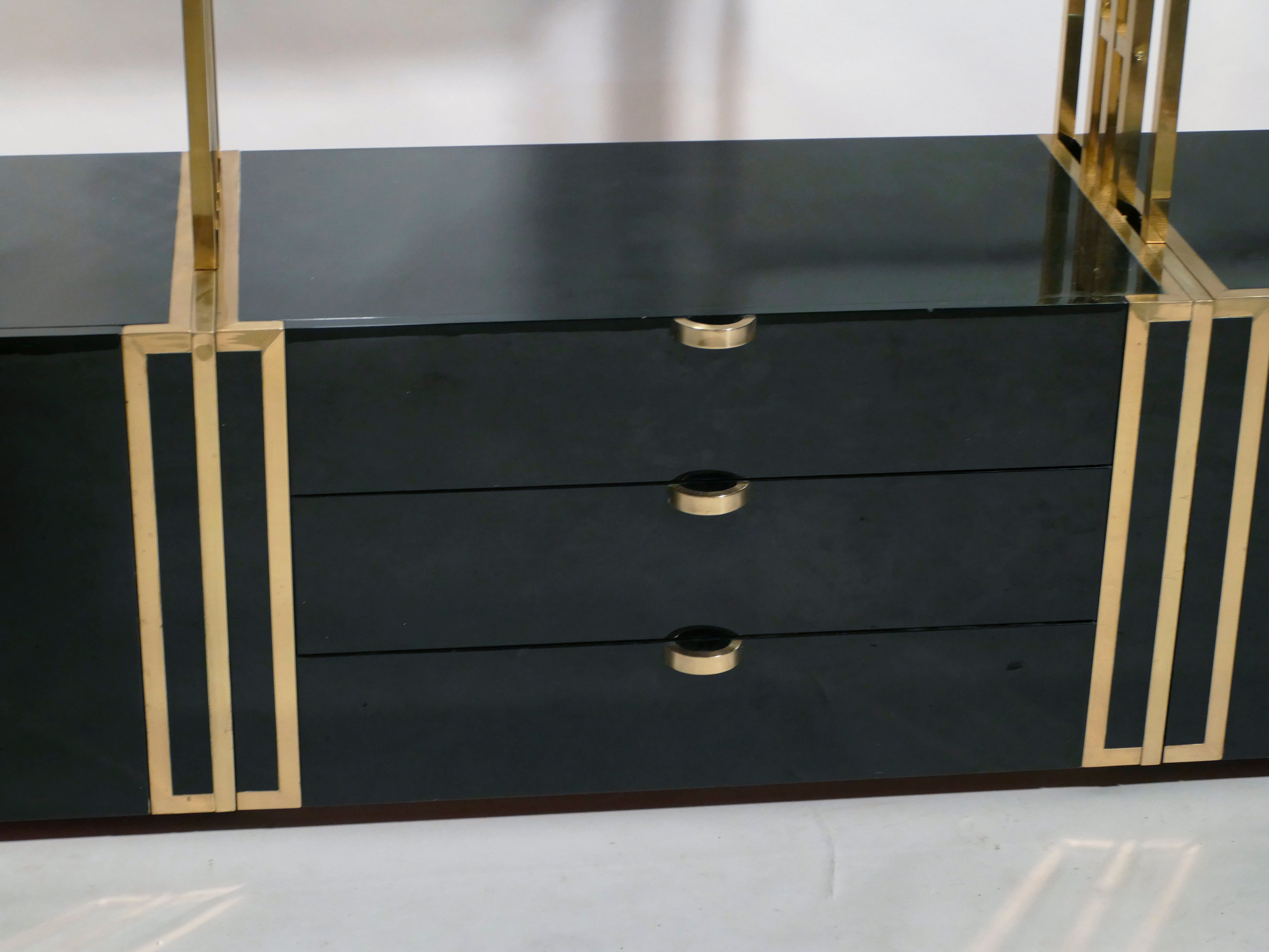 Brass laced library shelf by Kim Moltzer 1970