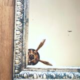 Old mercury mirror, in carved wood with silver leaf.