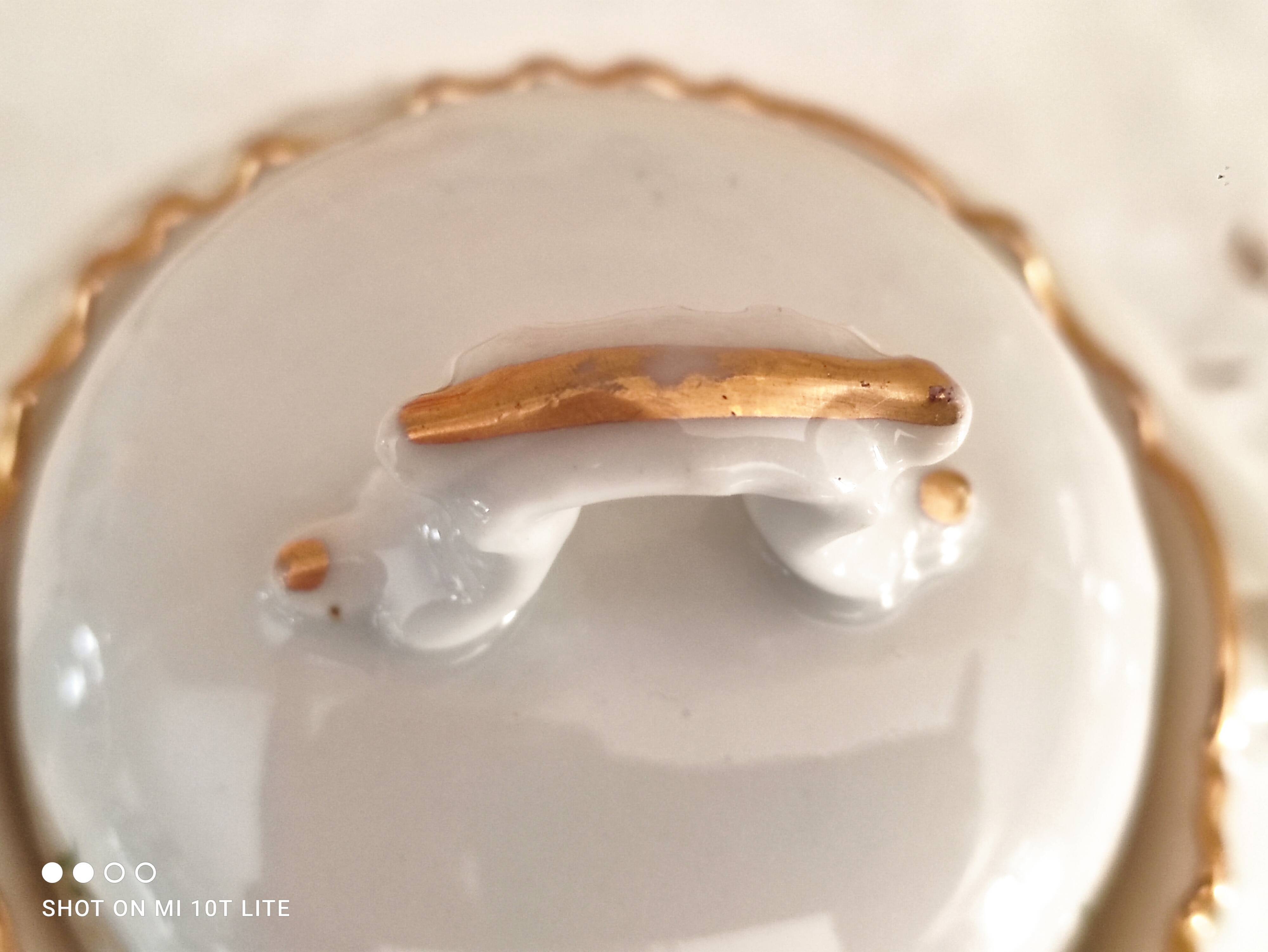 White porcelain sugar bowl decoration in relief and green and gold frieze