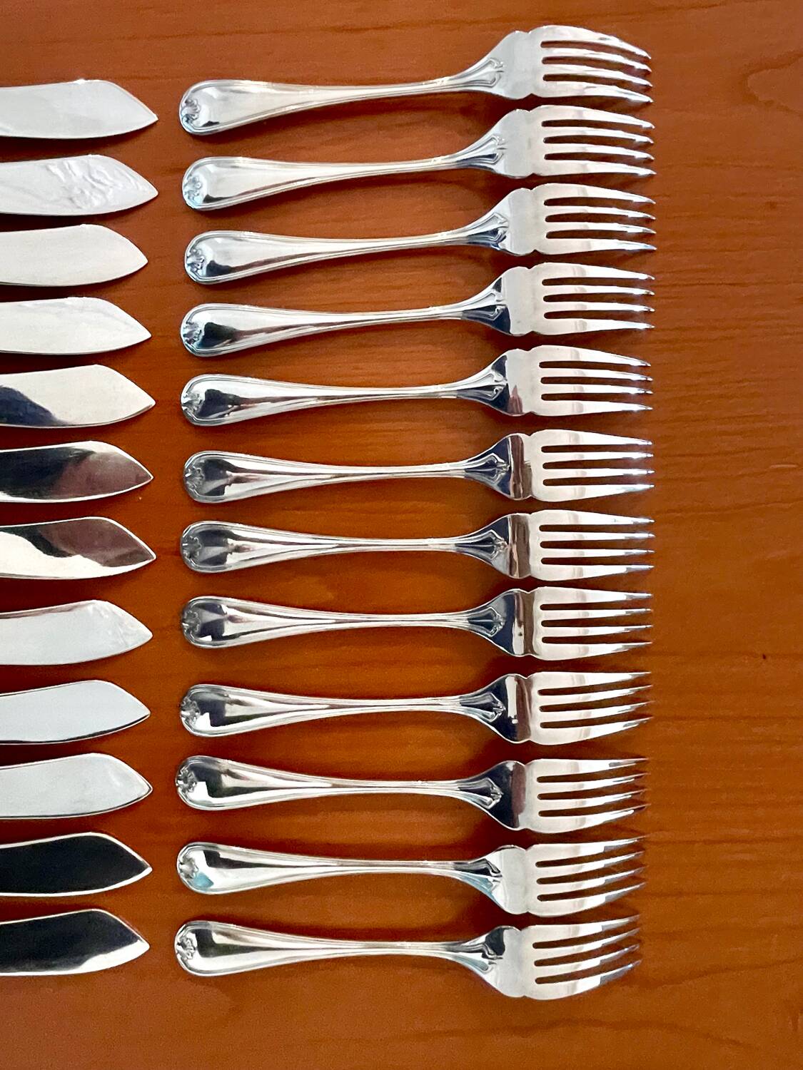 Christofle Marot Berain, 12 fish cutlery sets, shell decor