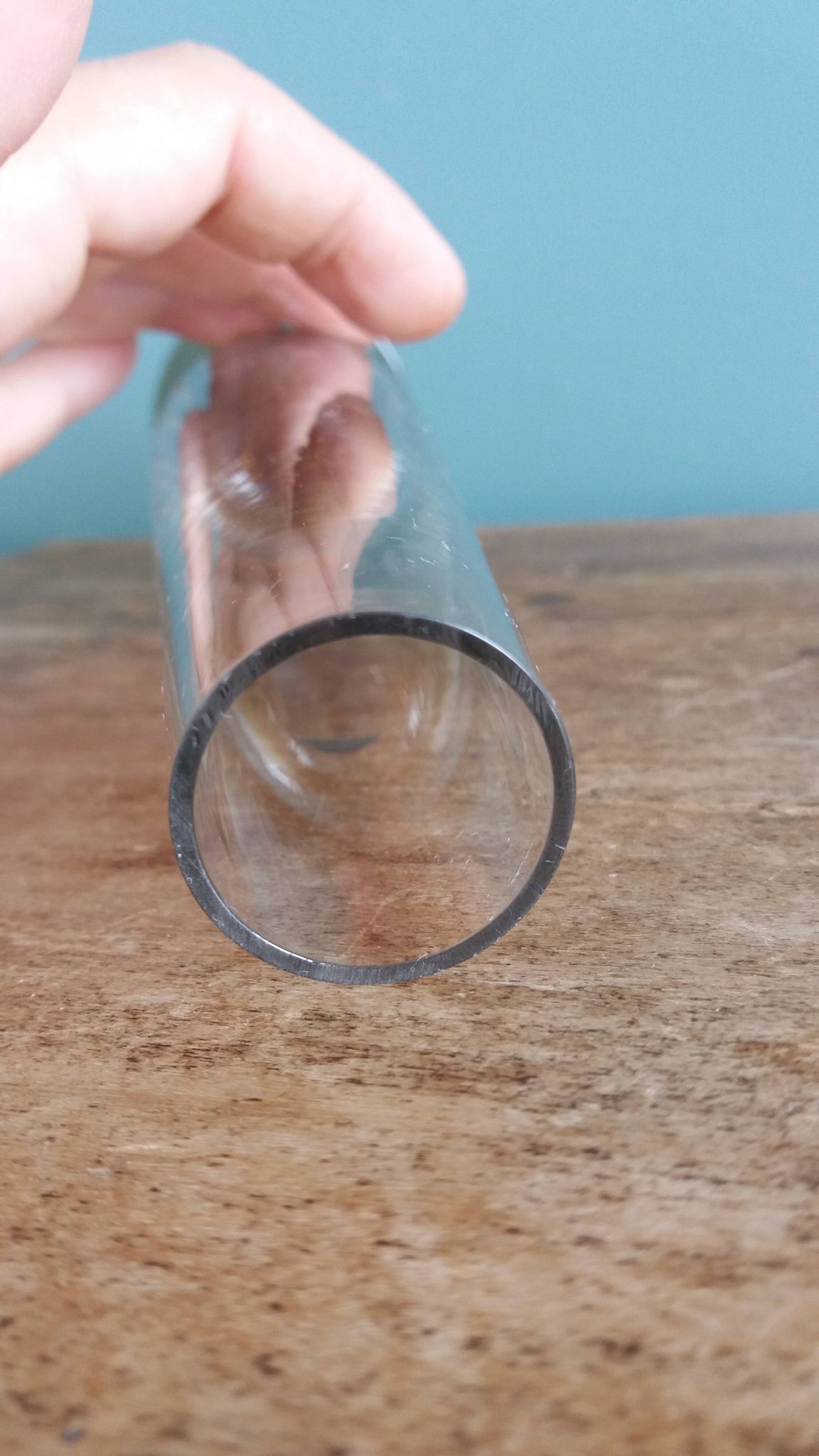 Cut glass soliflore vase with a smoked glass base.