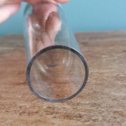 Cut glass soliflore vase with a smoked glass base.
