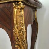 Console transforming into a 19th century Louis XV style gaming table