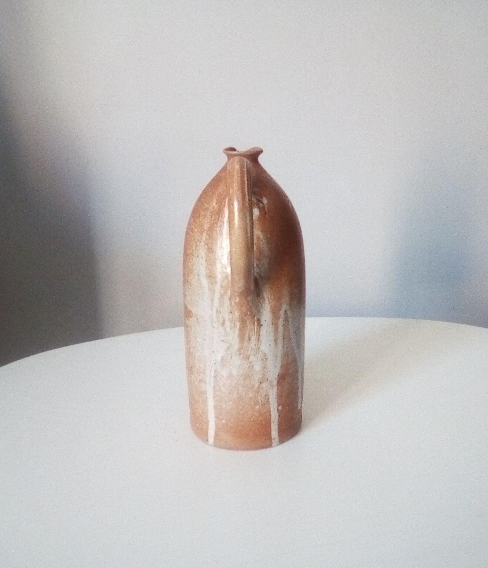 Vintage pitcher jug in sandstone