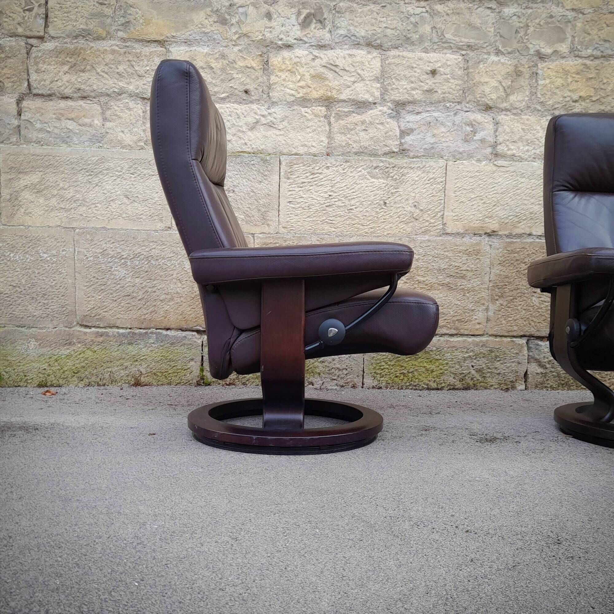Pair of Scandinavian leather armchairs and ottoman, Ekornes, Norway, 1970