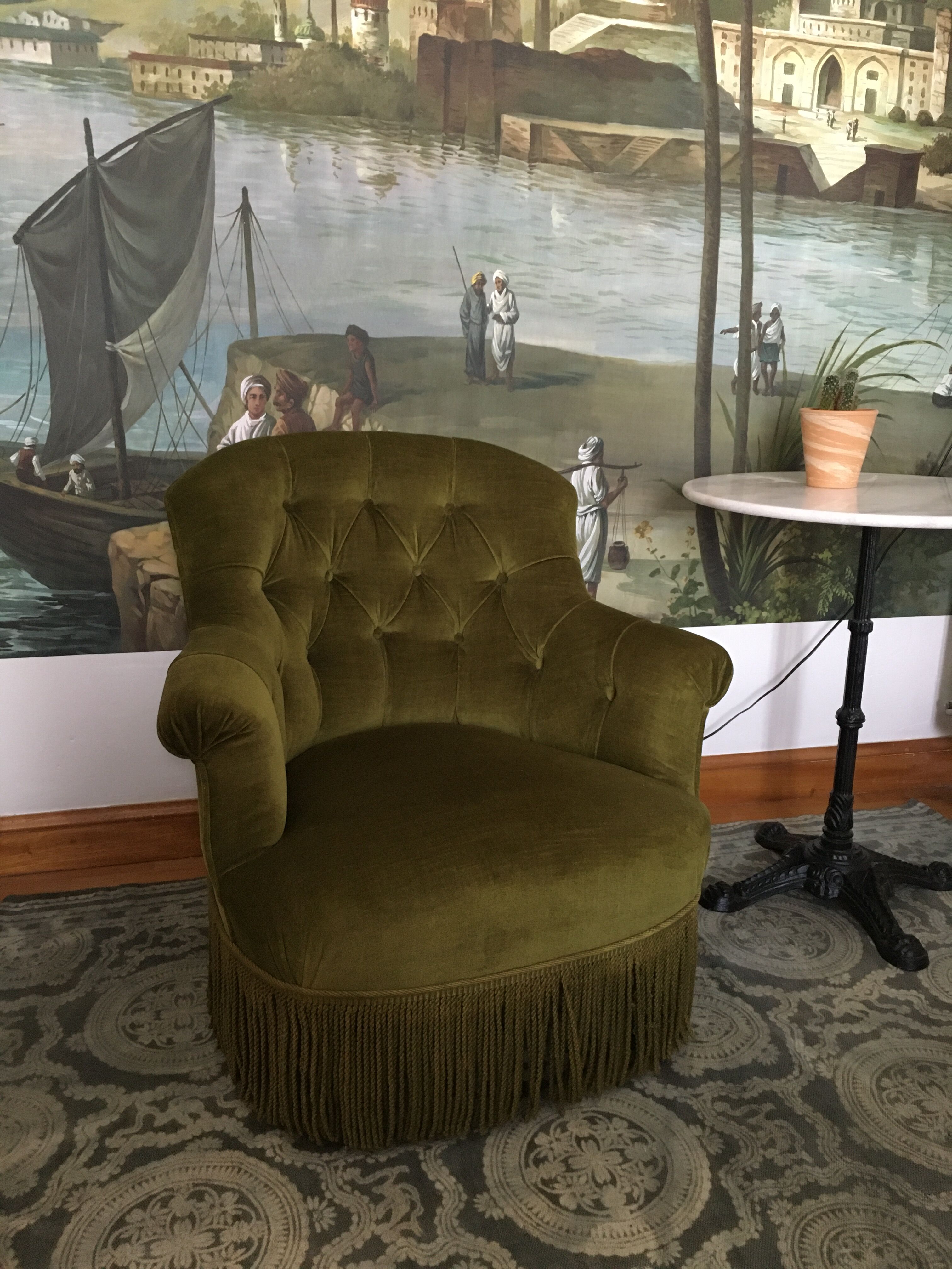Old chair padded green velvet