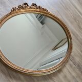 Ancien miroir ovale avec cadre doré