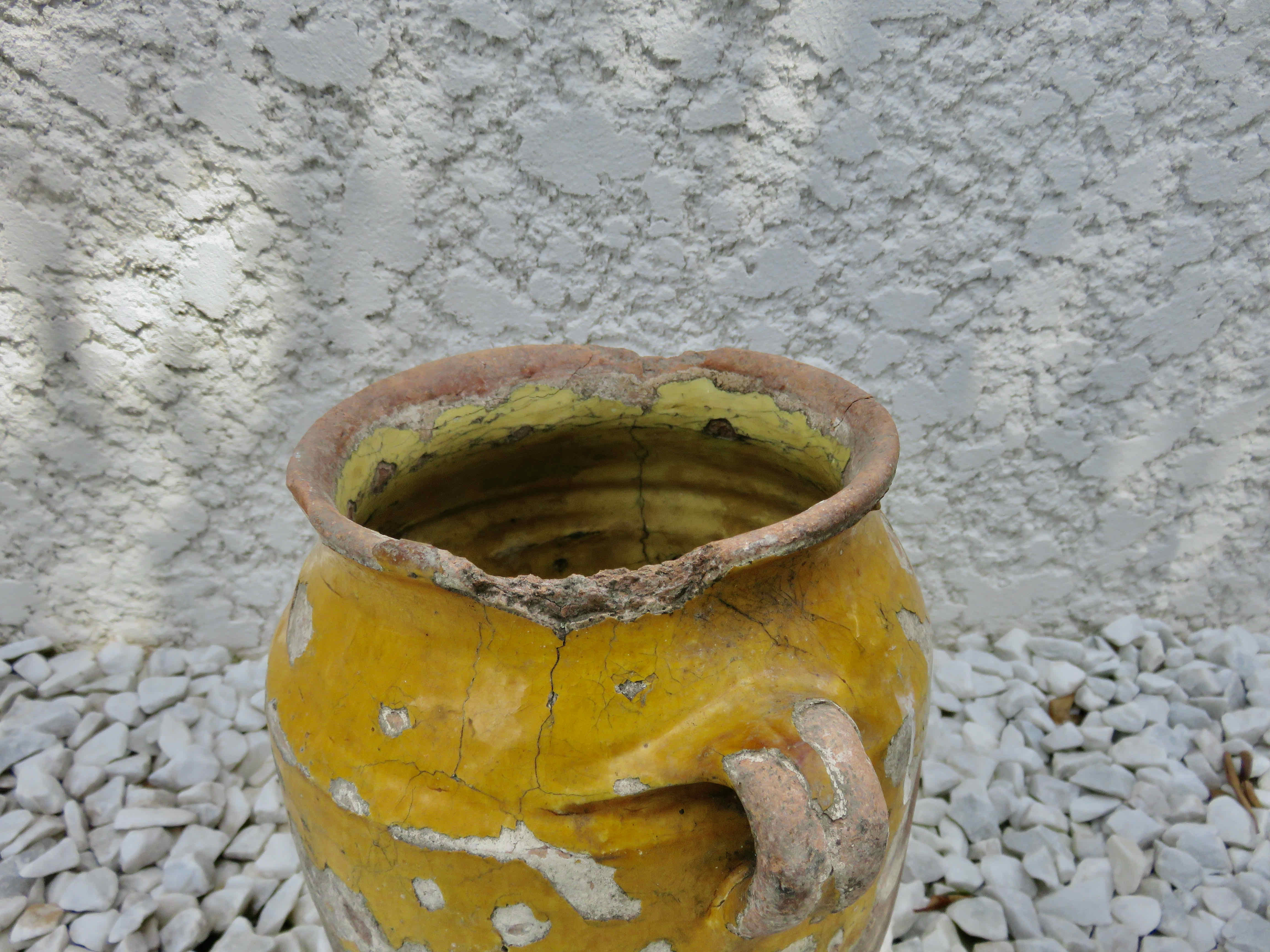 Old candied pot in yellow glazed terracotta XIX century
