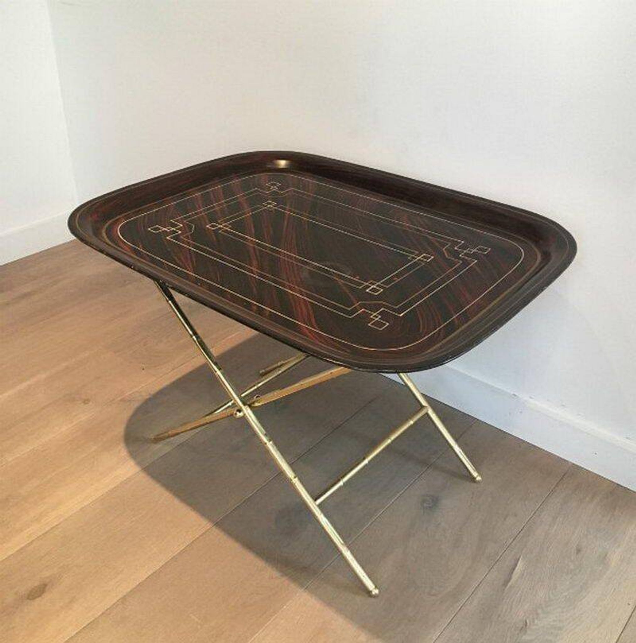 Beautiful table with a brass top and painted sheet metal