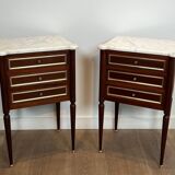 Pair of mahogany and brass side tables or bedside tables with Carrara marble tops.