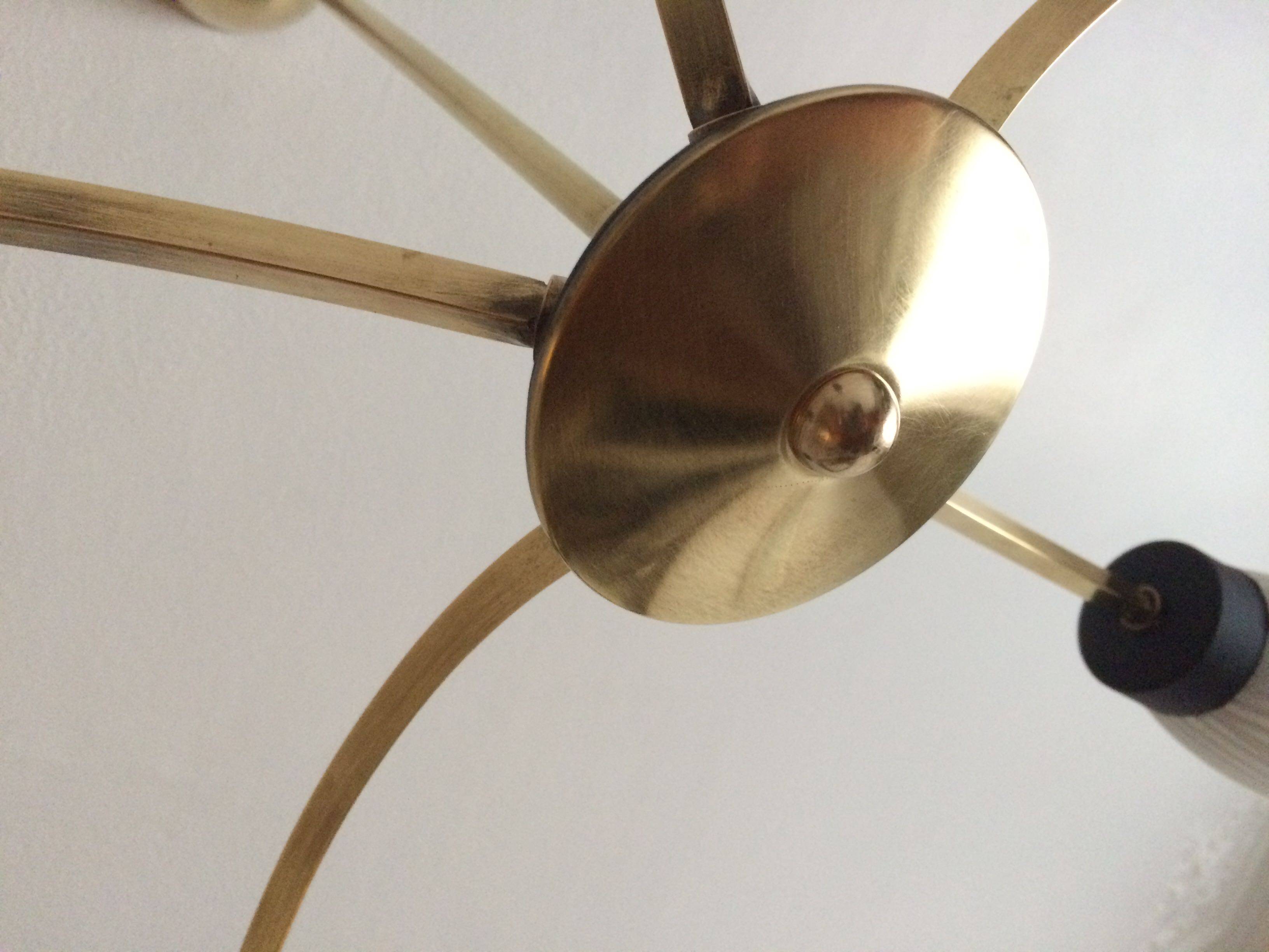 Lustre with 5 branches from the 1960s - 1970s in solid brass and black metal.