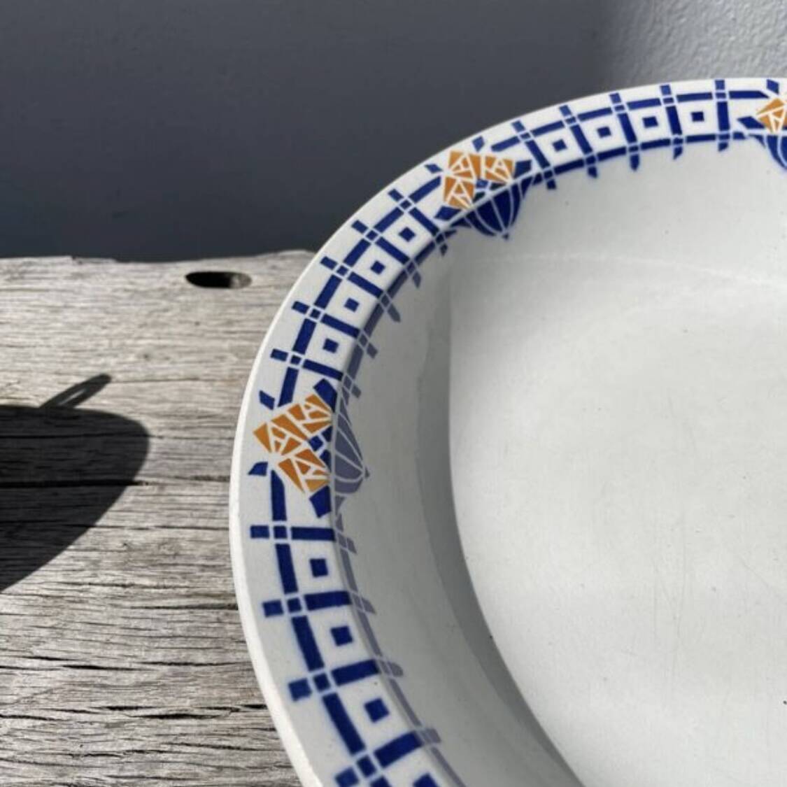 Round, shallow ceramic salad bowl from Saint Amand