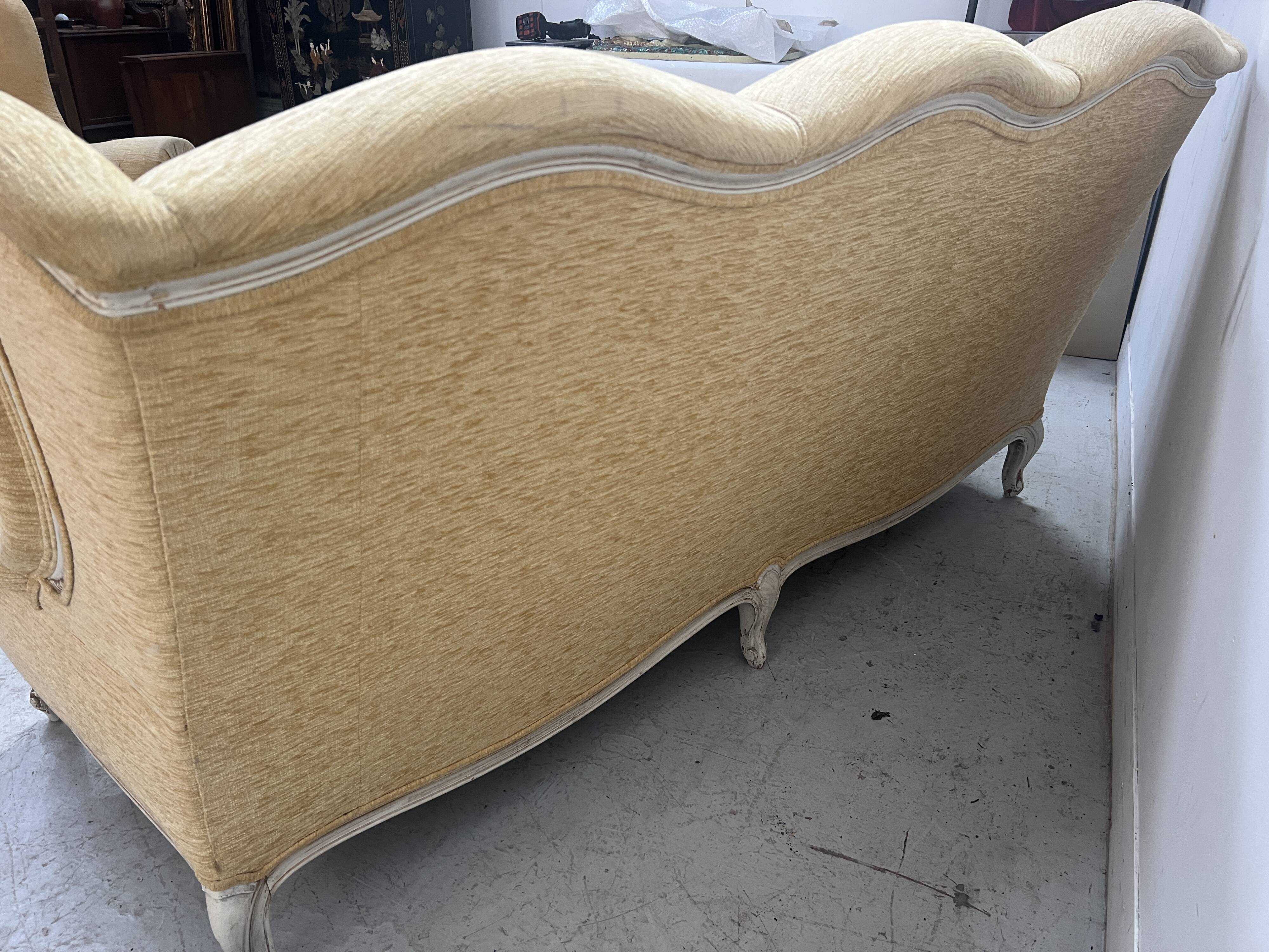 Louis XV style three-seater wingback sofa in patinated beech, 20th century