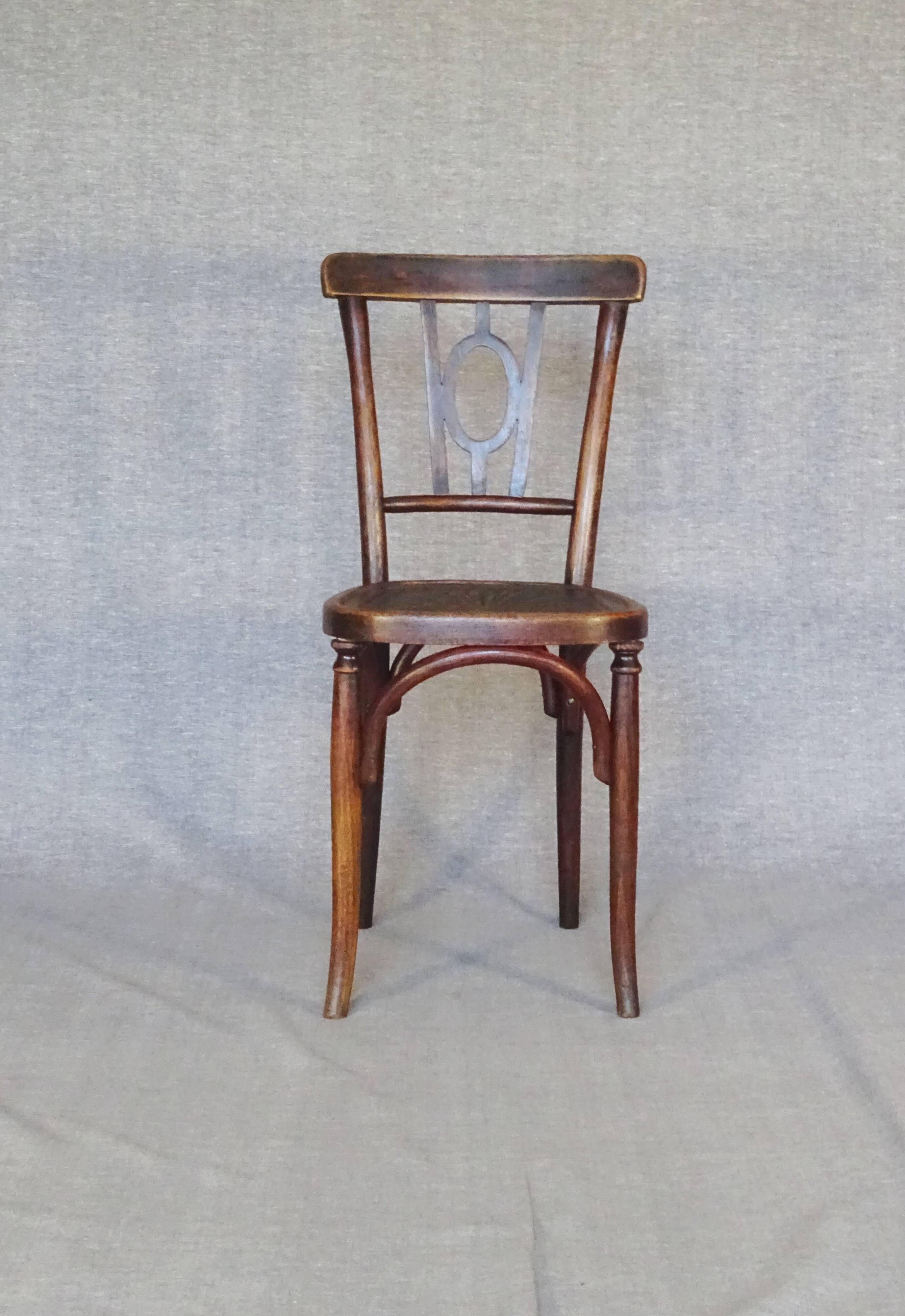 Set of 4 mismatched bistro chairs, 1900 to 1930 with wooden seats, Thonet, Baumann