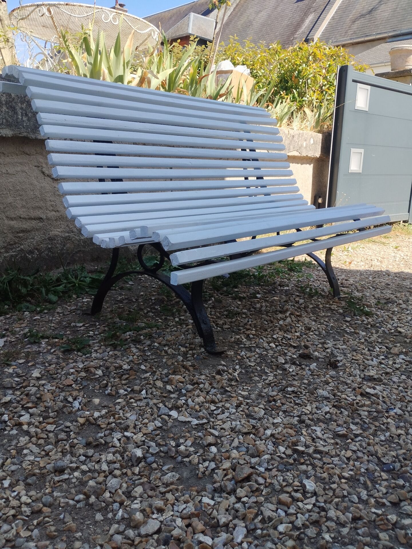 Antique garden bench with cast iron legs