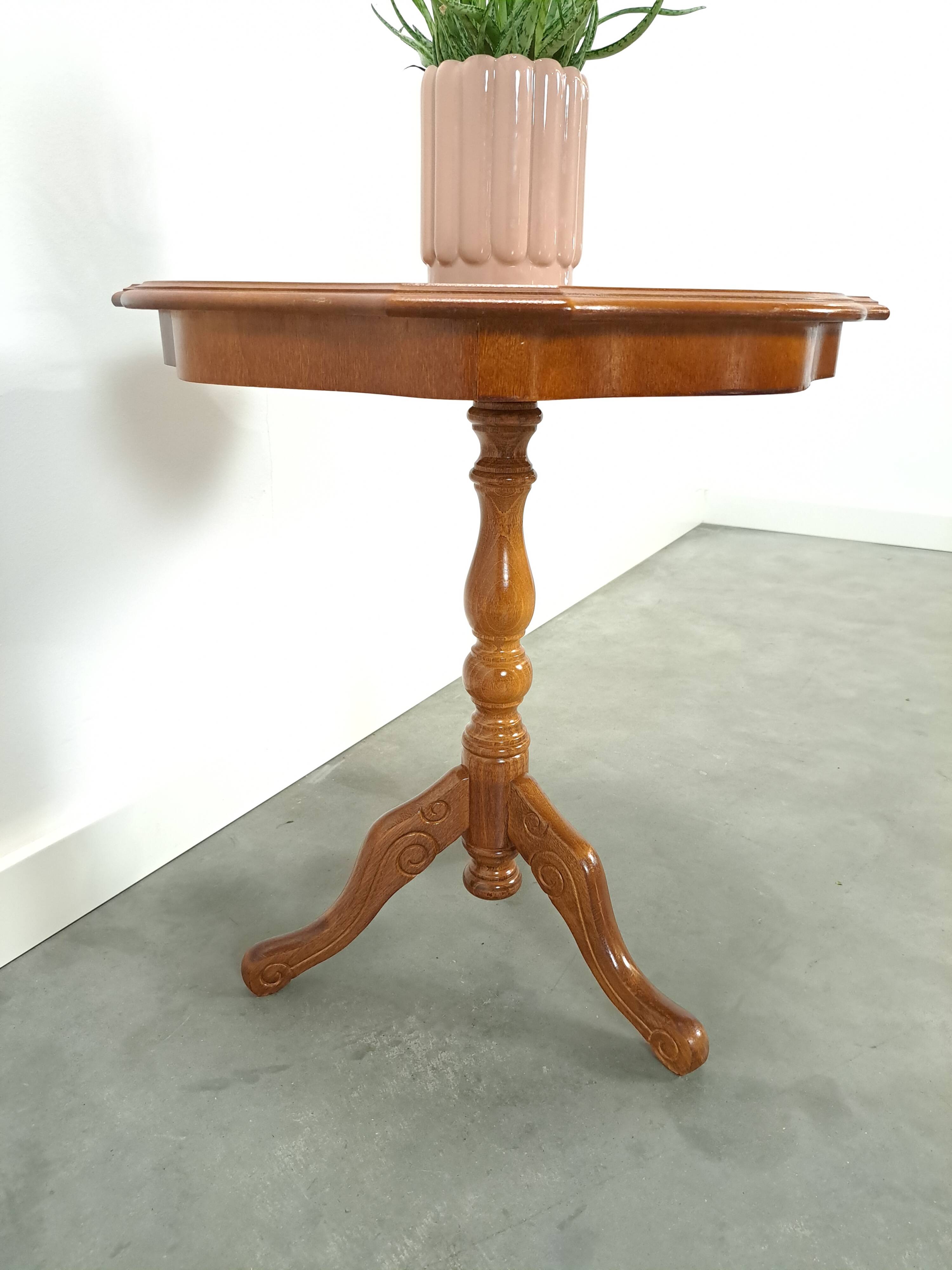 Round vintage wooden side table with inlaid veneer