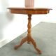 Round vintage wooden side table with inlaid veneer