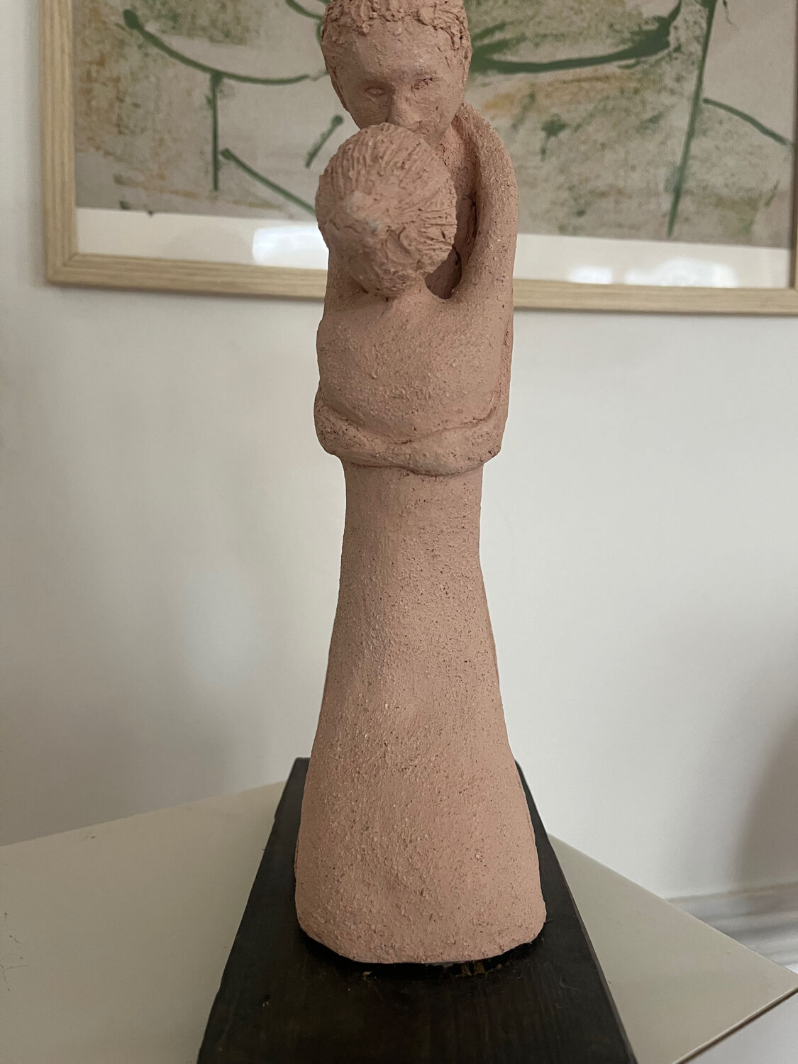 Terracotta sculpture of an entwined couple.